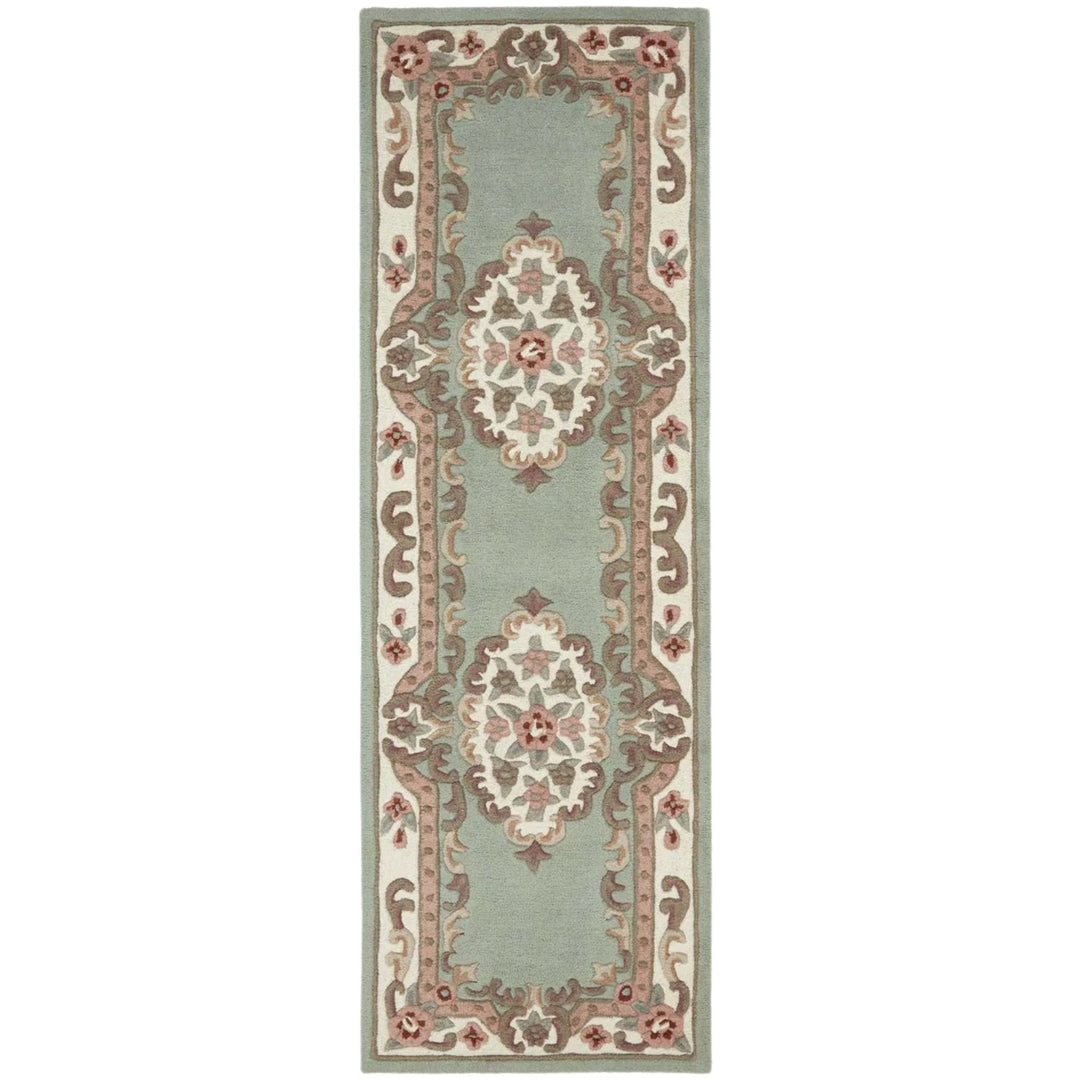 Decorative rug with intricate patterns on a light green background