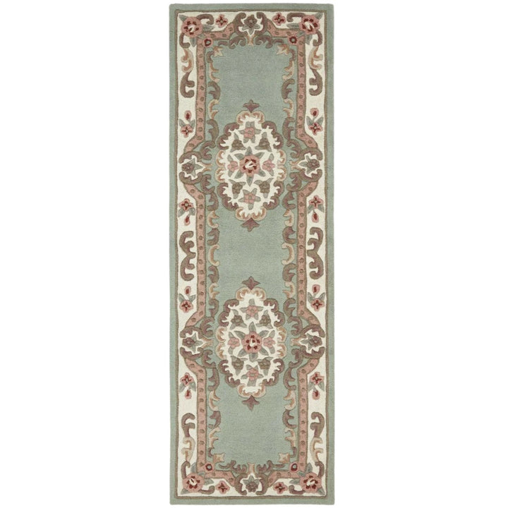Decorative rug with intricate patterns on a light green background