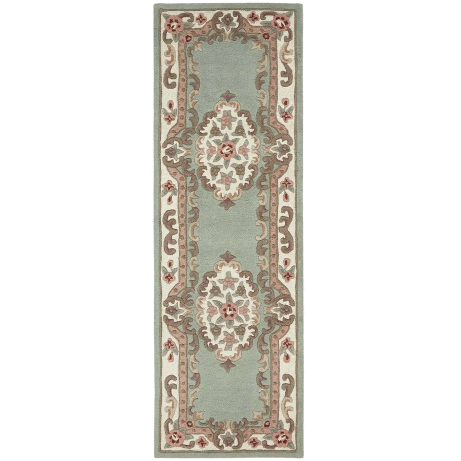 Decorative rug with intricate patterns on a light green background