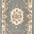 Decorative rug with floral patterns and a central medallion on a gray background