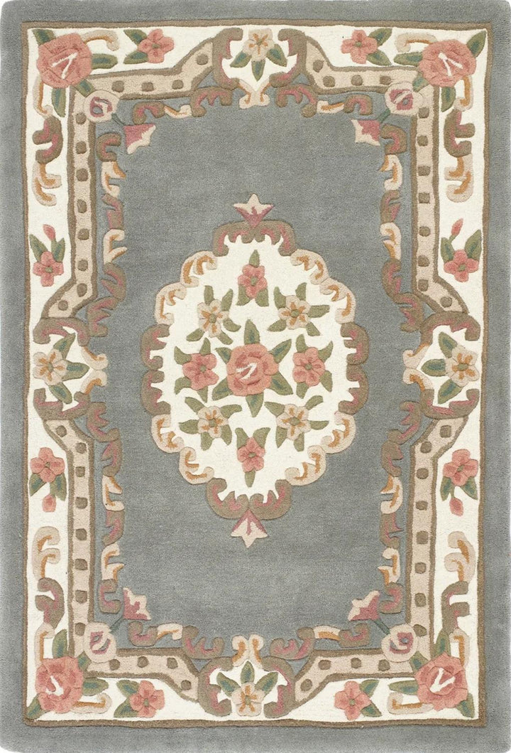Decorative rug with floral patterns and a central medallion on a gray background