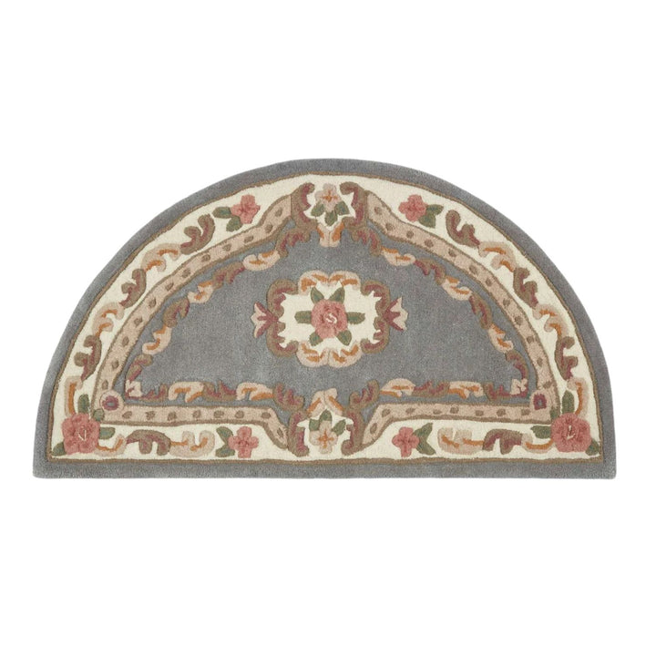 Decorative half-moon rug with floral and geometric patterns on a white background
