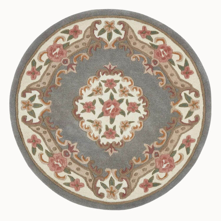 Round decorative rug with floral patterns on a white background