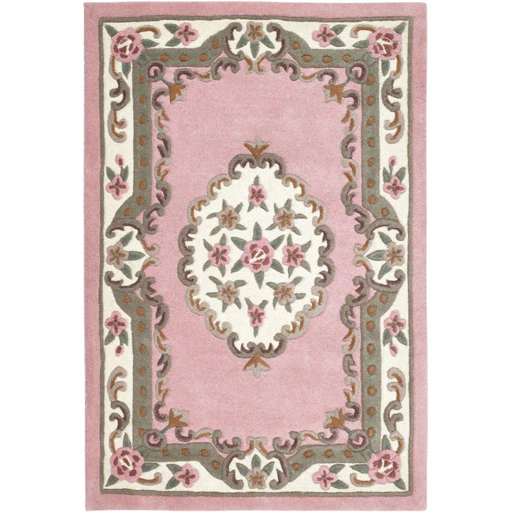 Decorative pink rug with floral patterns on a white background