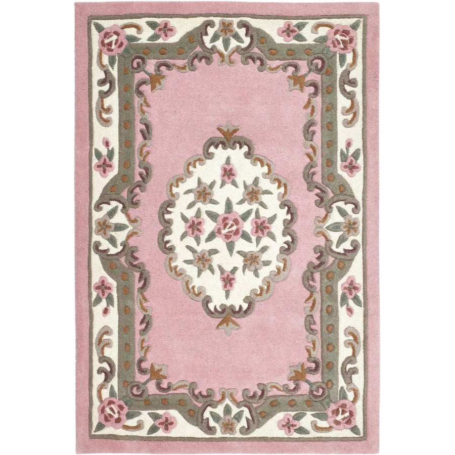 Decorative pink rug with floral patterns on a white background