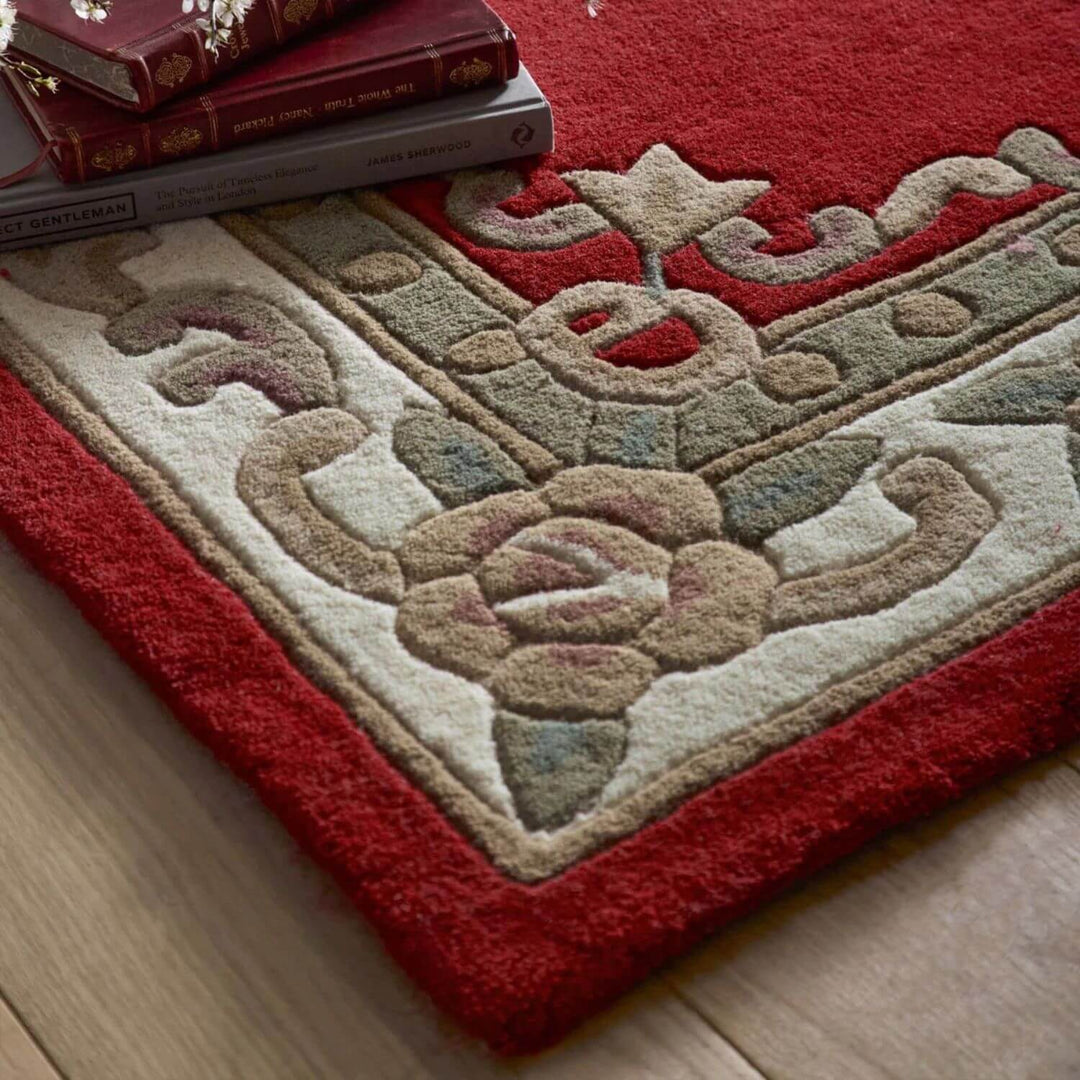 Decorative rug with intricate patterns on a wooden floor