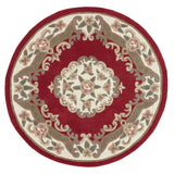 Round red area rug with floral patterns on a white background