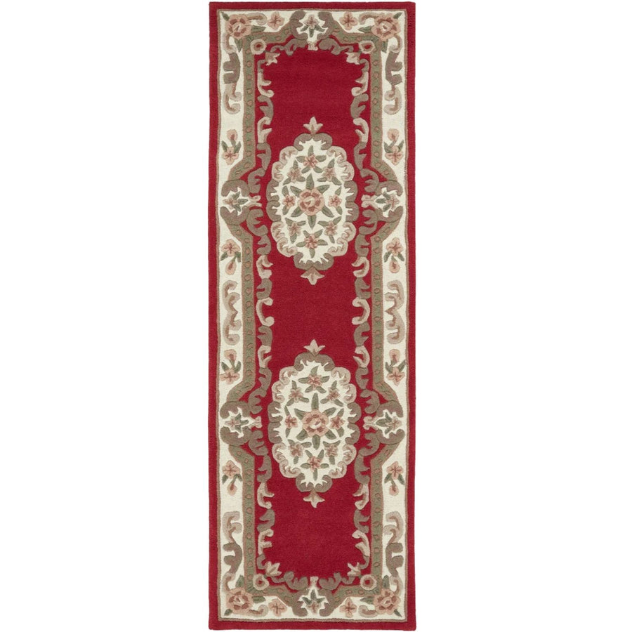 Decorative red and beige runner rug with intricate patterns on a white background