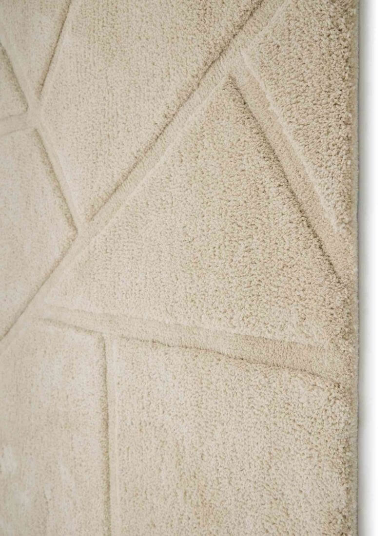 Close-up of a Scandinavian deep pile rug in cream with geometric patterns, ideal for modern and cozy interiors.
