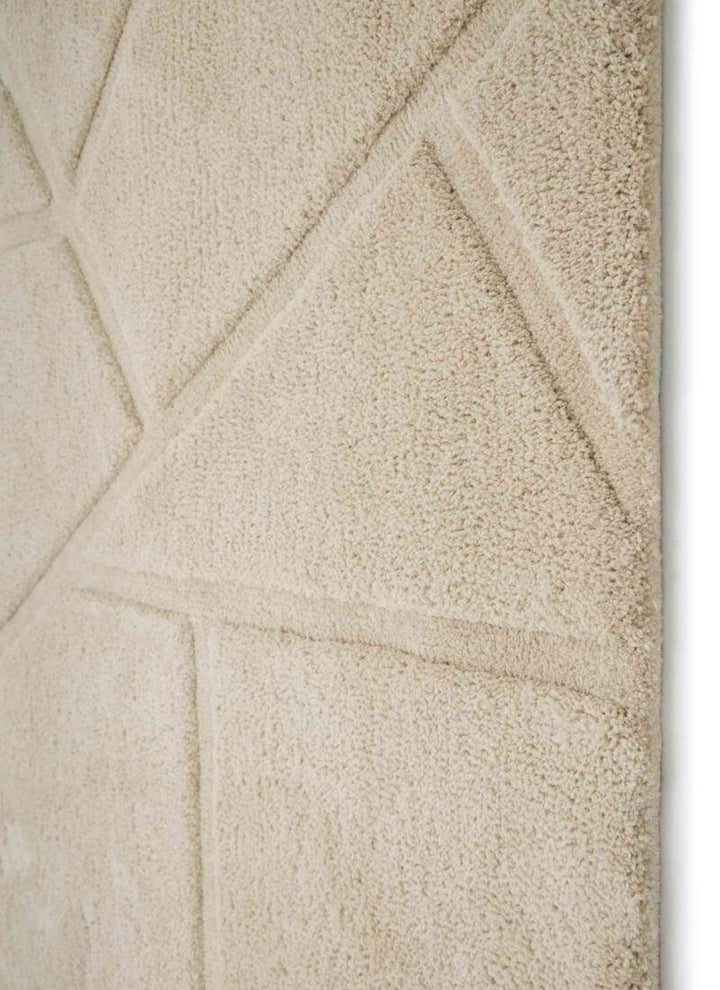Close-up of a Scandinavian deep pile rug in cream with geometric patterns, ideal for modern and cozy interiors.
