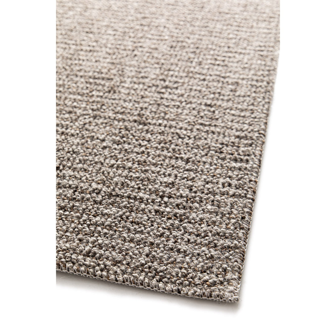 Dune Boucle taupe textured rug, close-up of the bound edge | The Rugs