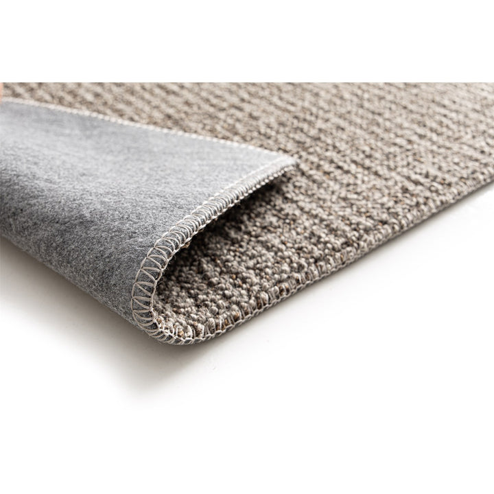 Dune Boucle taupe textured rug, corner folded back to show the soft felt backing | The Rugs