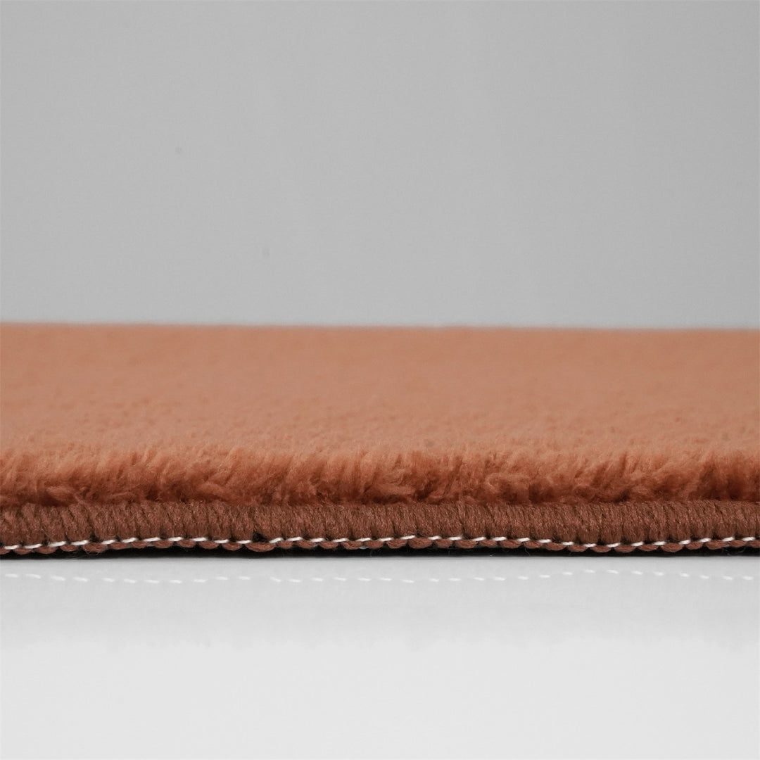 Washmellow terra washable rug, side view of the low pile and edge at floor level | The Rugs