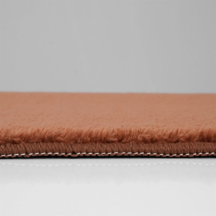 Washmellow terra washable rug, side view of the low pile and edge at floor level | The Rugs