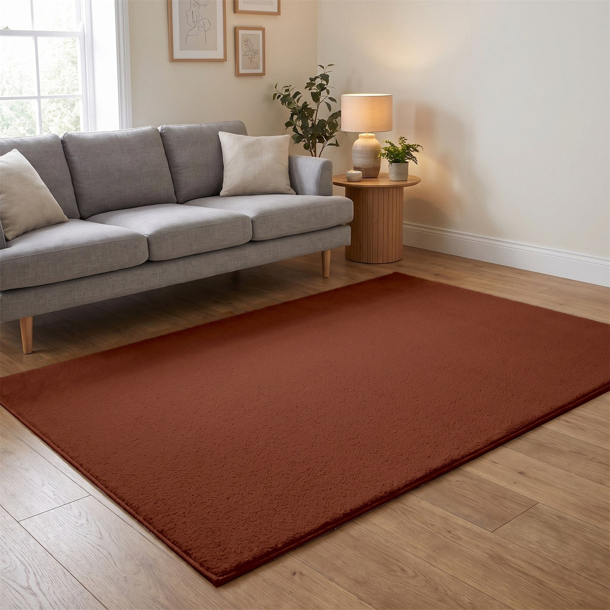Washmellow terra washable rug in a living room with a grey sofa and oak floor | The Rugs
