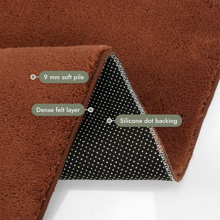Washmellow terra washable rug, folded corner showing the pile, felt layer and backing | The Rugs