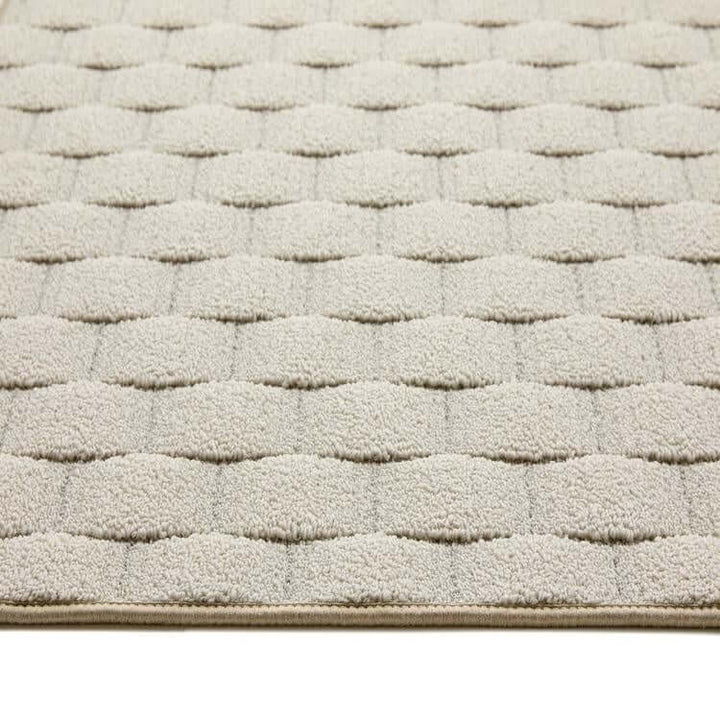 textured cream geometric mat 