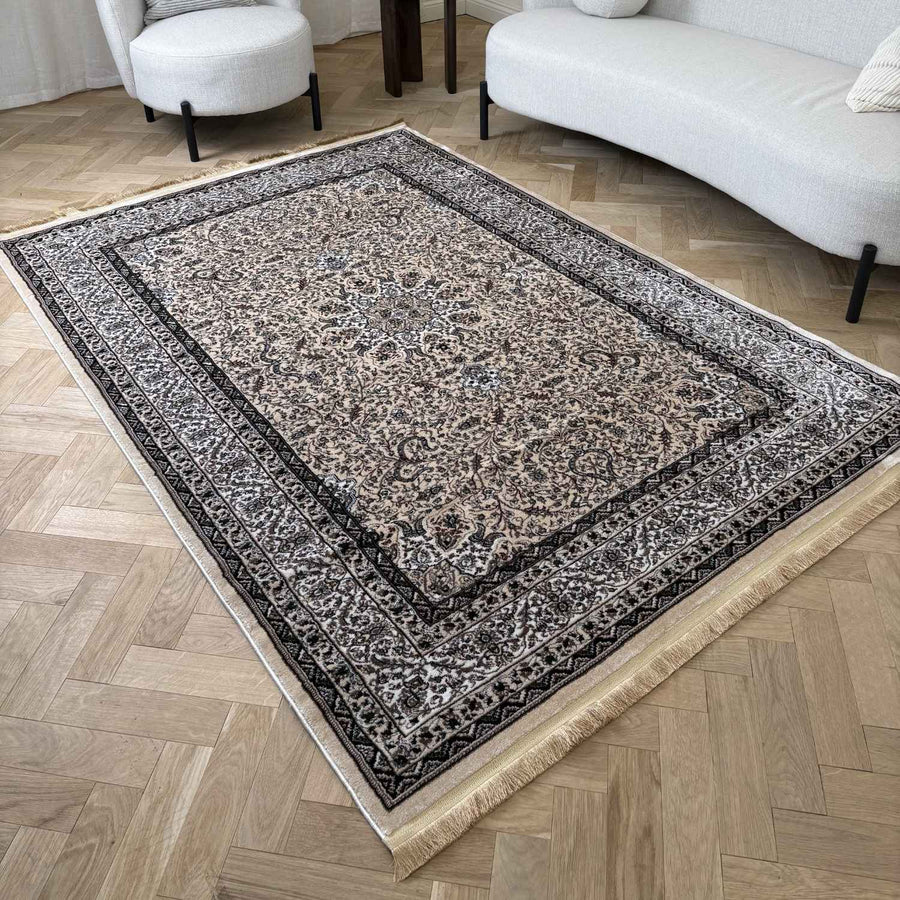 Decorative rug with intricate patterns on a wooden floor