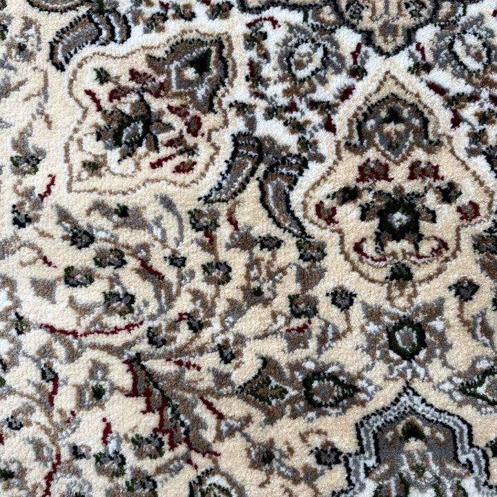Close-up of a patterned rug with intricate designs.