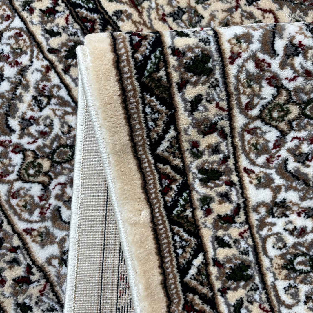 Close-up of a patterned rug with intricate designs.