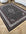 Decorative rug with intricate patterns on a wooden floor