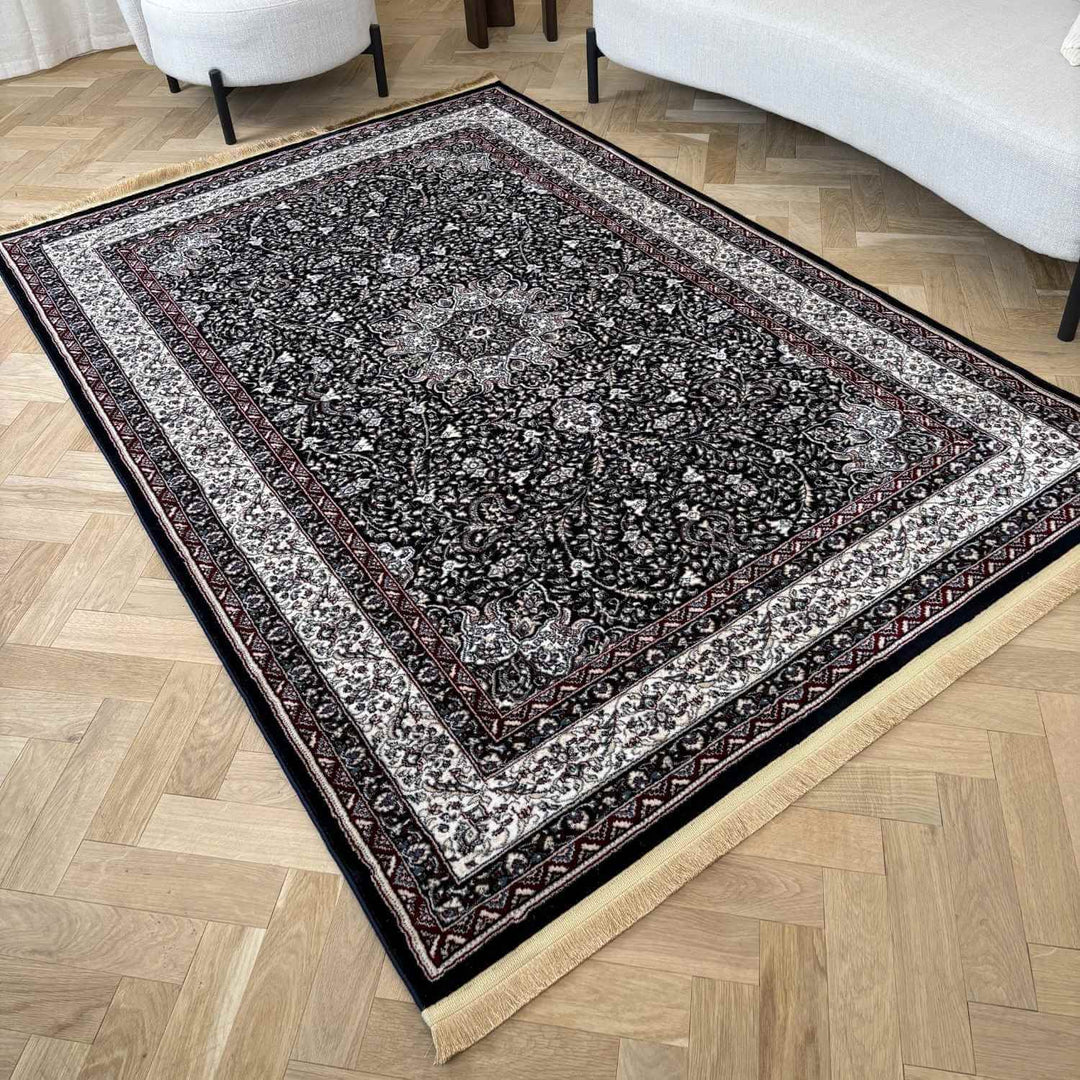 Decorative rug with intricate patterns on a wooden floor