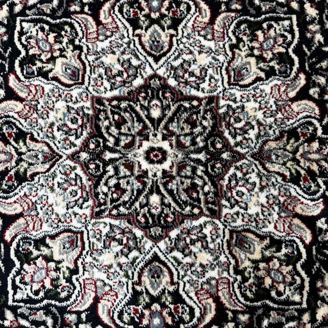 Close-up of a patterned fabric with intricate designs.