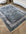 Decorative rug with intricate patterns on a wooden floor