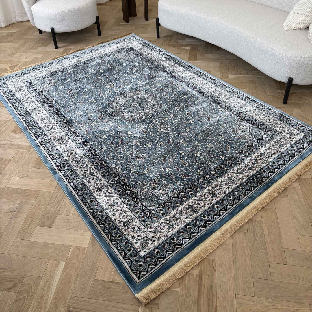 Decorative rug with intricate patterns on a wooden floor