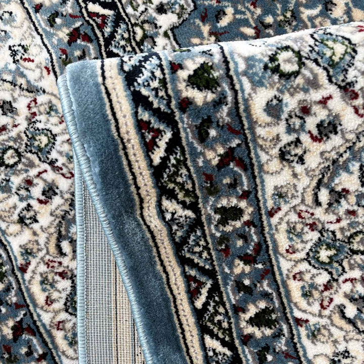 Close-up of patterned rugs with intricate designs and colors.