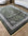 Decorative rug with intricate patterns on a wooden floor