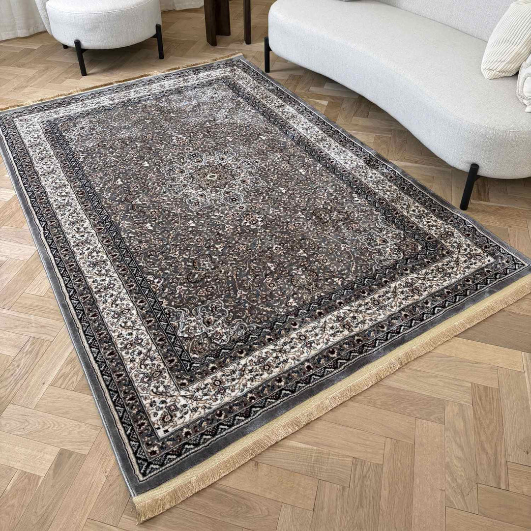 Decorative area rug with intricate patterns on a wooden floor