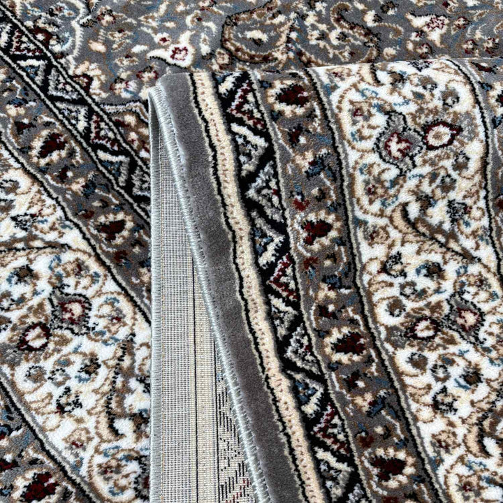 Close-up of a patterned rug with intricate designs.