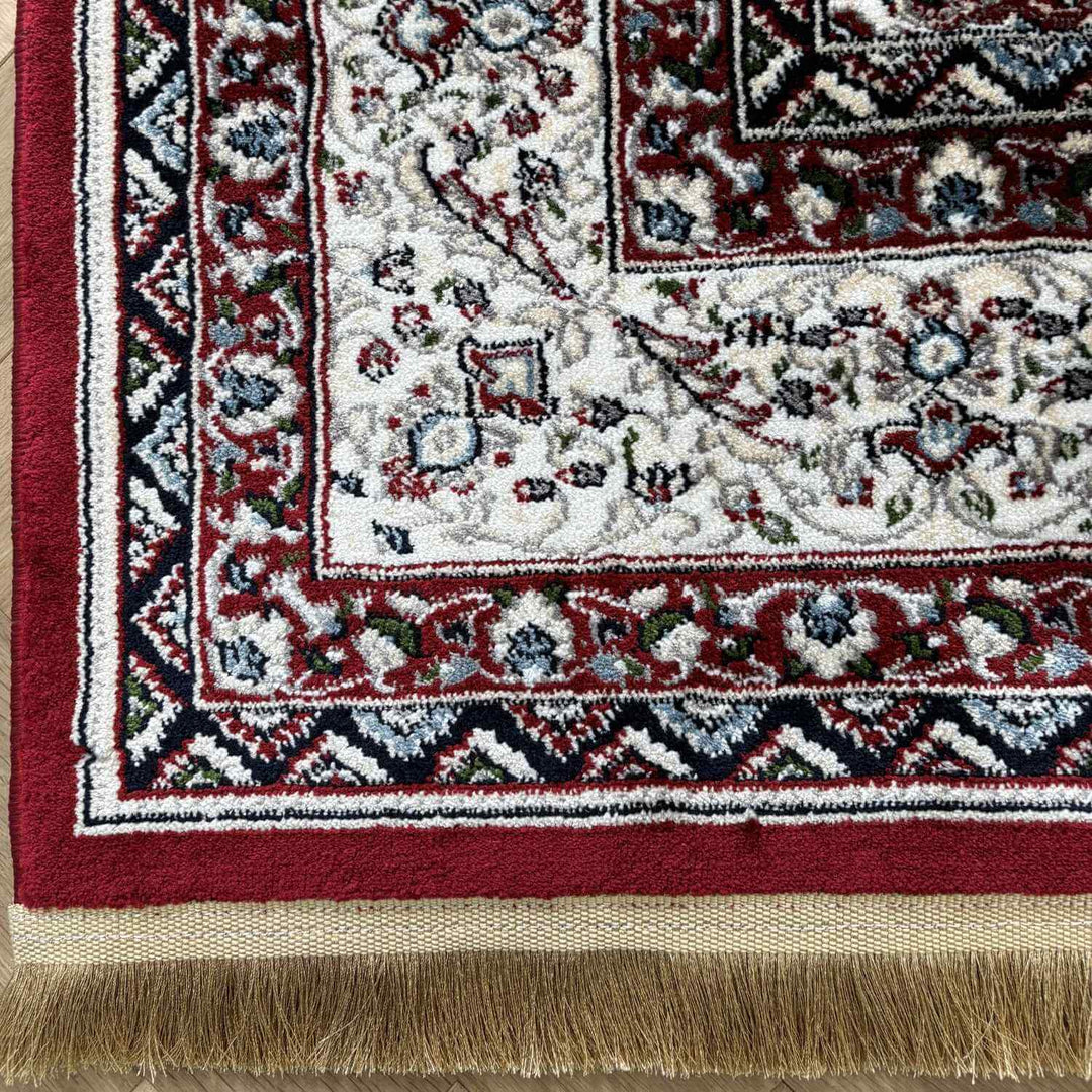 Close-up of a patterned rug with red, white, and blue colors.