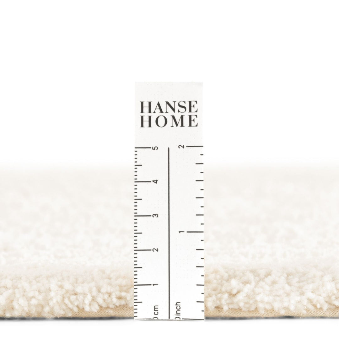Nursery rug pile, soft and durable materials.