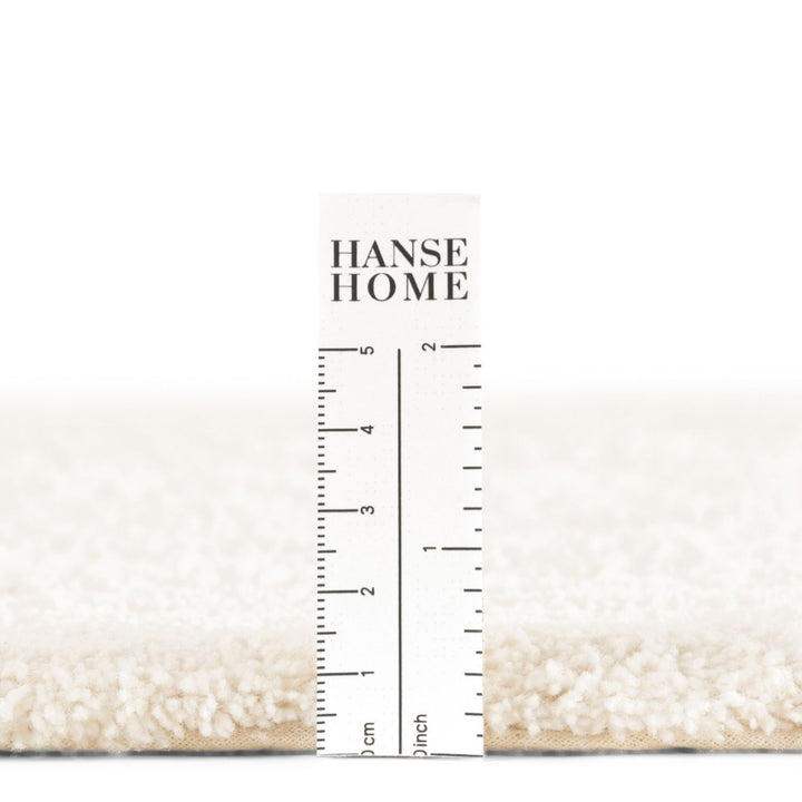 Nursery rug pile, soft and durable materials.