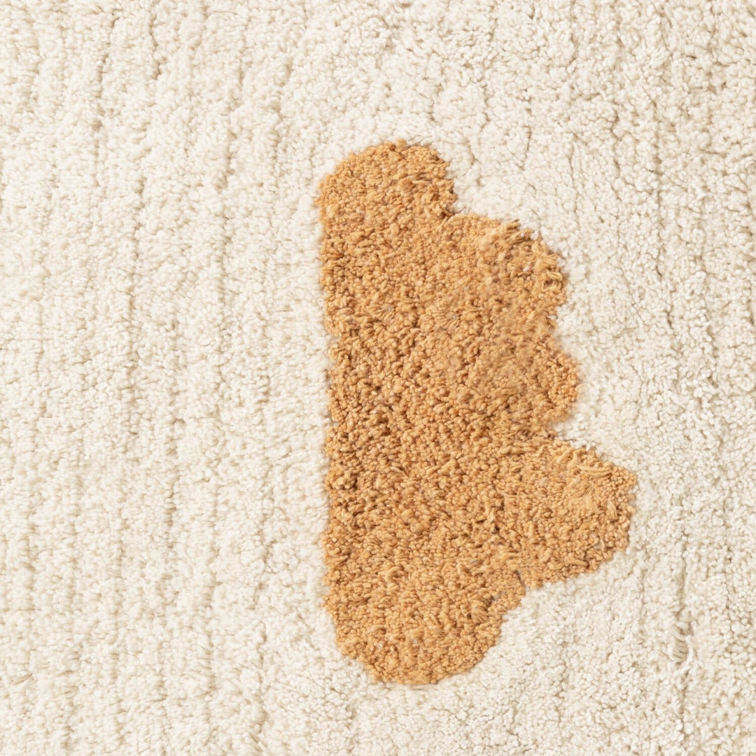 Brown carpet stain on a beige carpet
