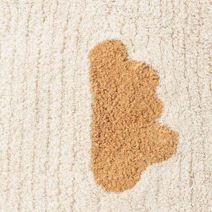 Brown carpet stain on a beige carpet