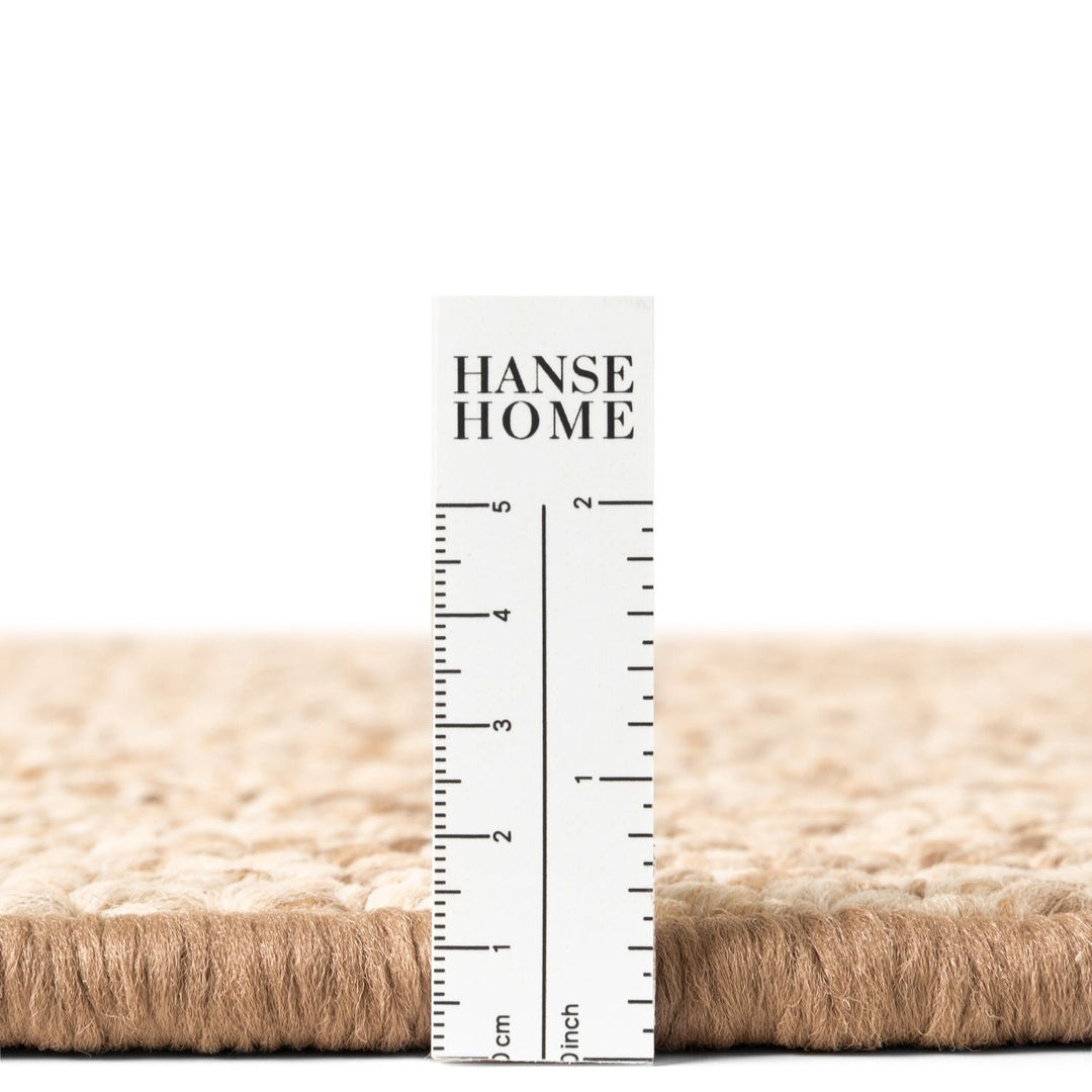 Hanse Home rug with a ruler showing dimensions on a white background
