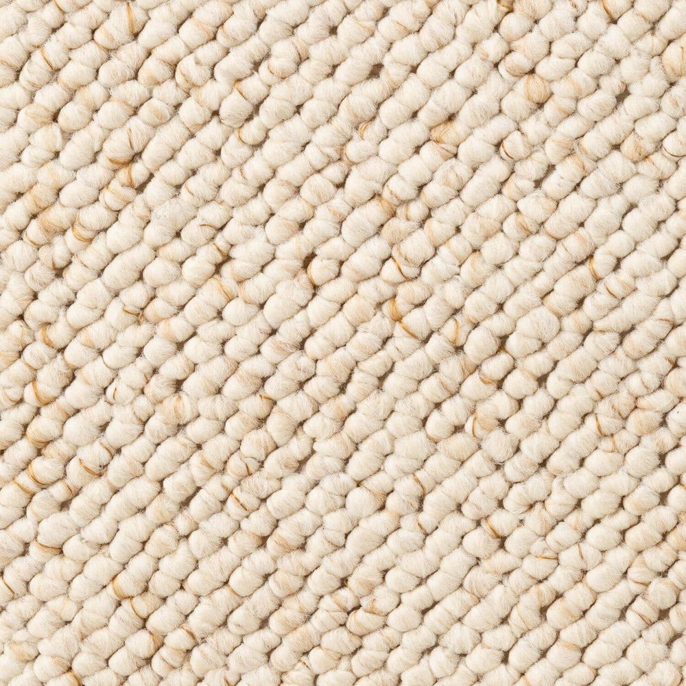 Close-up of a textured beige carpet