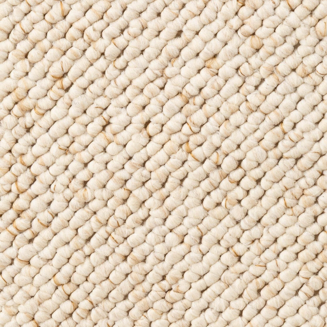 Close-up of a textured beige carpet