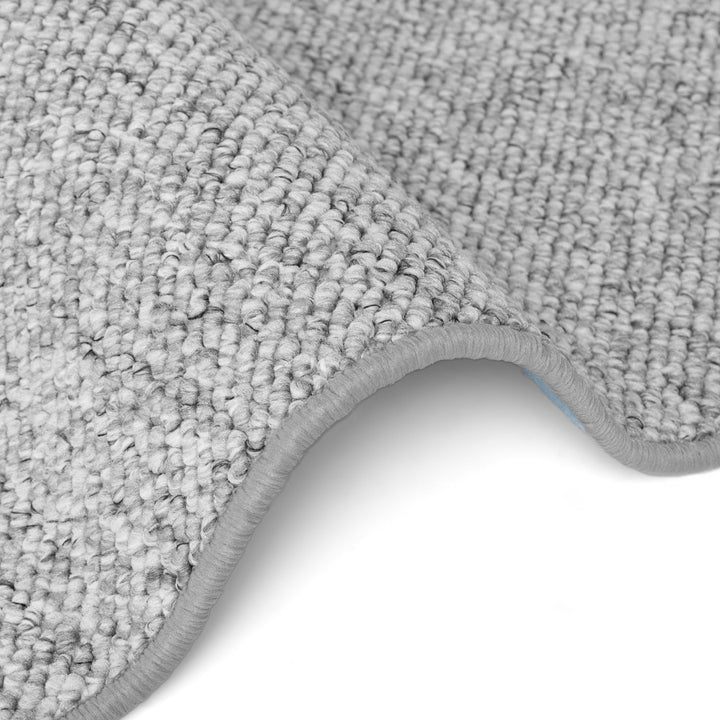 Close-up of a gray carpet with a white background