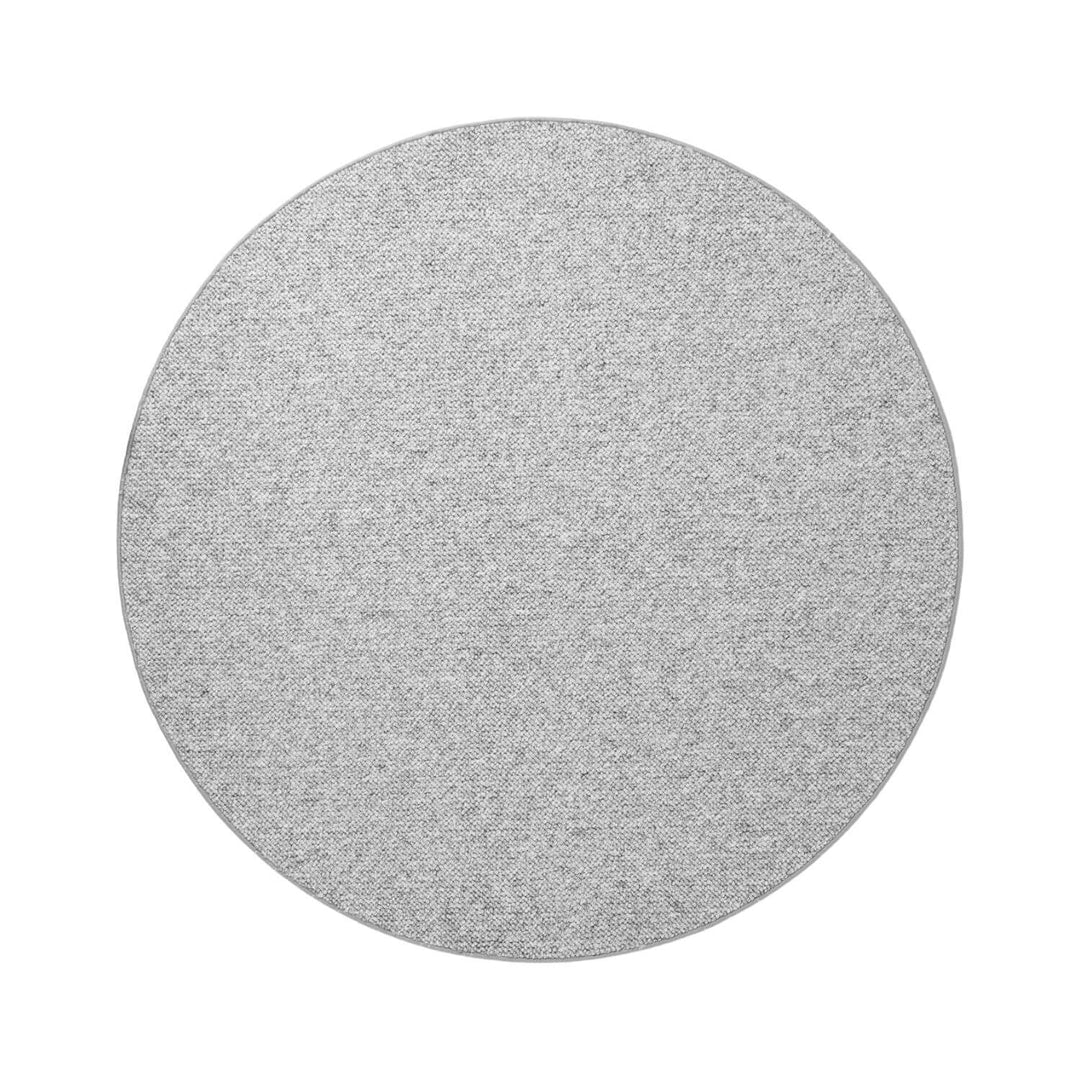 Round gray rug on a white background