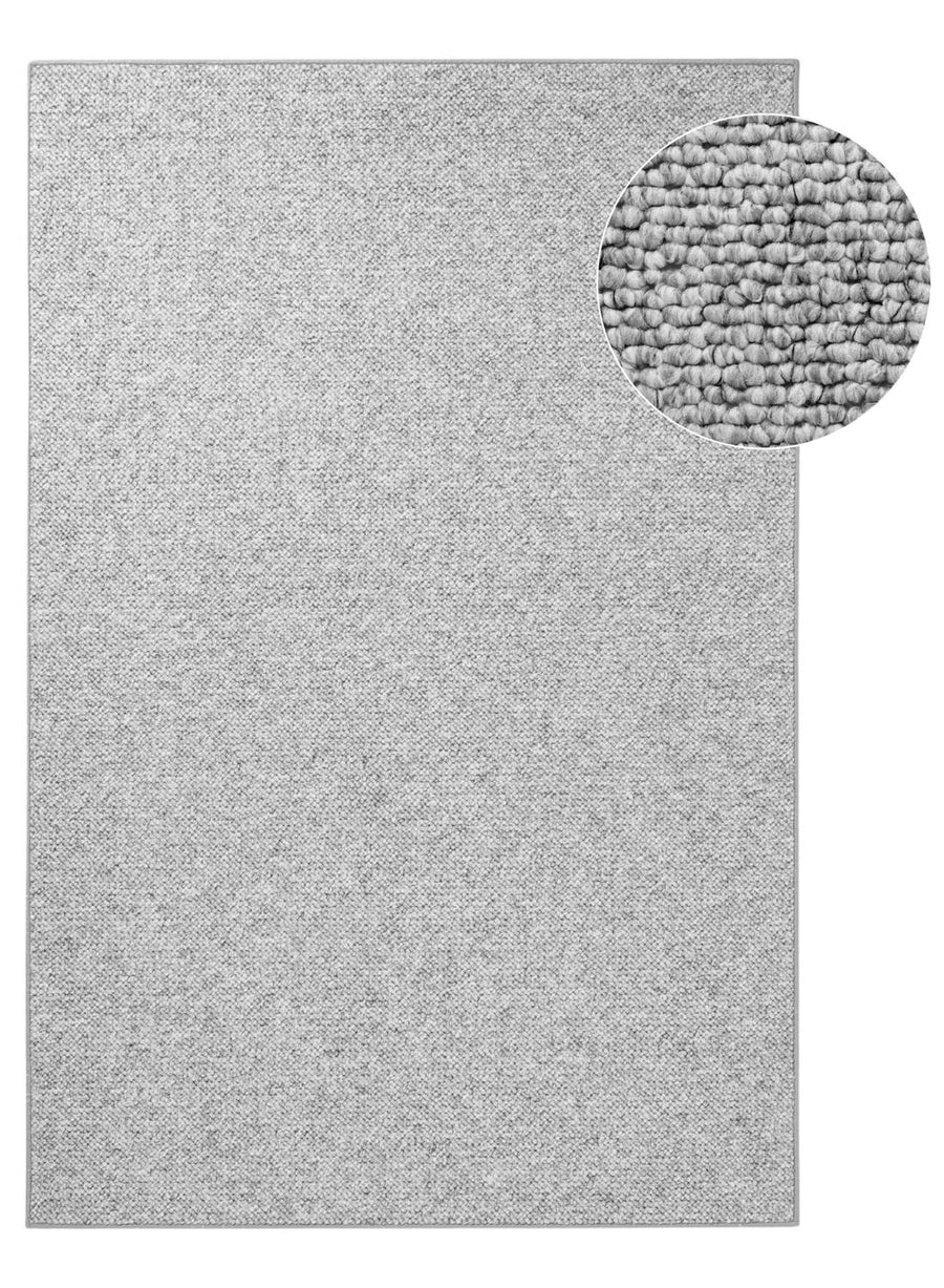 Textured gray rug with a close-up detail on a white background