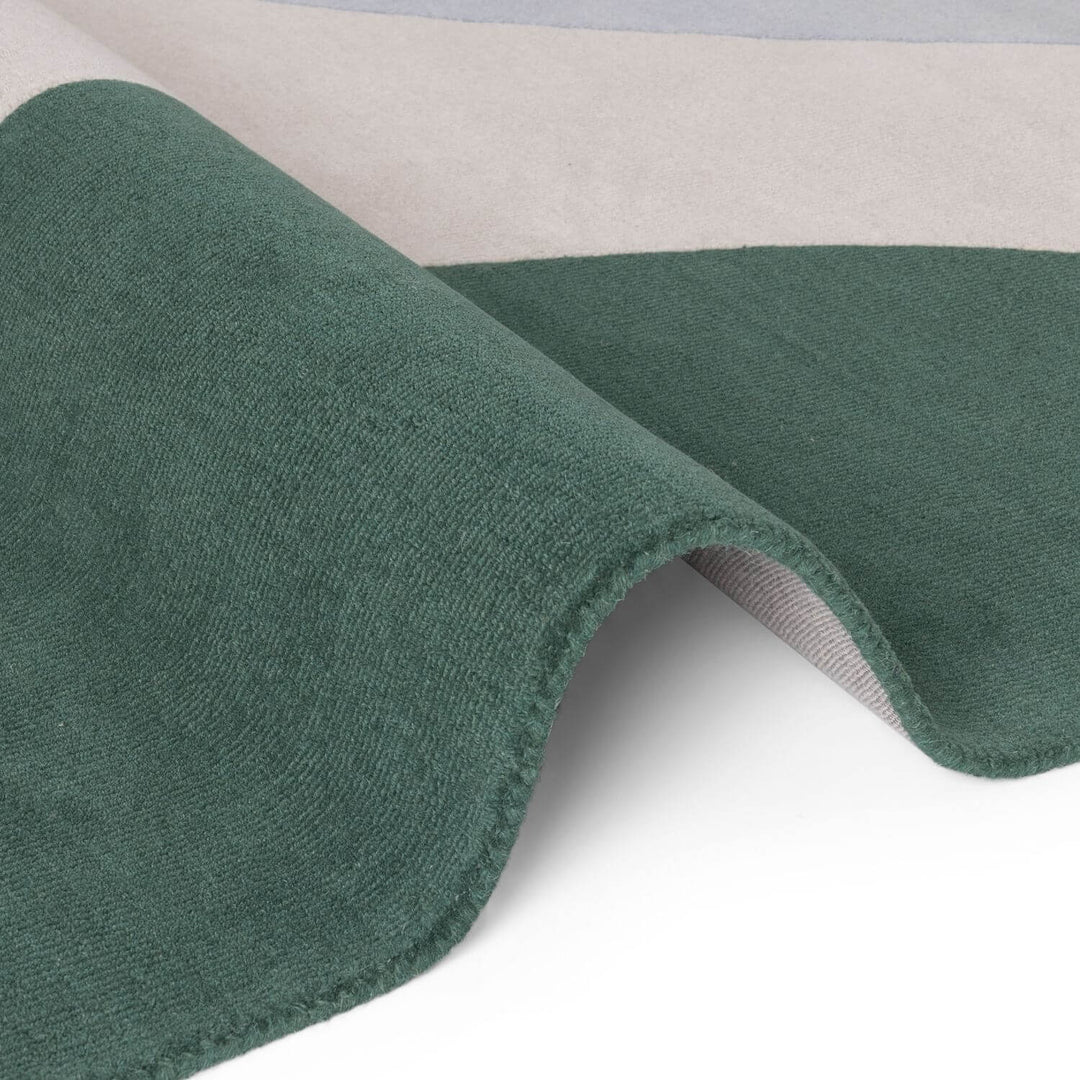 Close-up of green fabric with a textured surface on a white background
