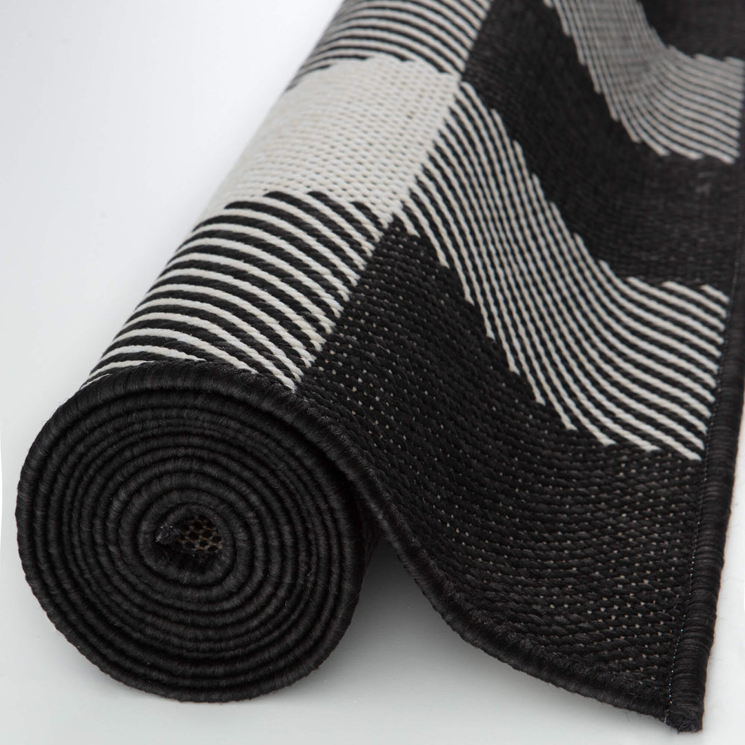 outdoor-rug-black-checkered-design-rolled